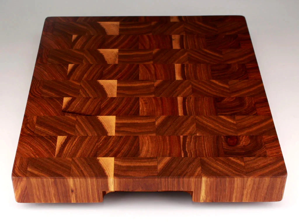End-grain Kiaat cutting board showing chevron grain pattern